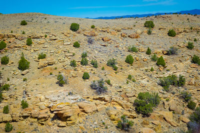 Rock formations on landscape against sky