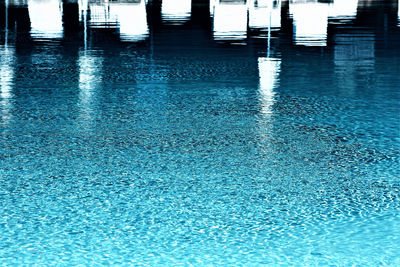 Beautiful beach chairs around outdoor swimming pool in hotel