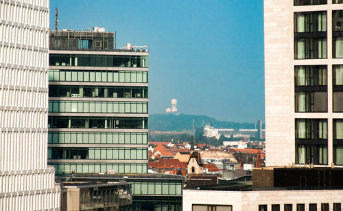 Buildings in city against sky