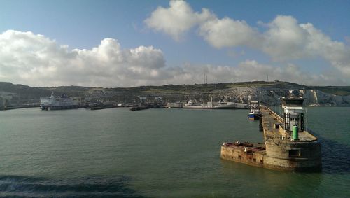 Port of dover against cloudy sky