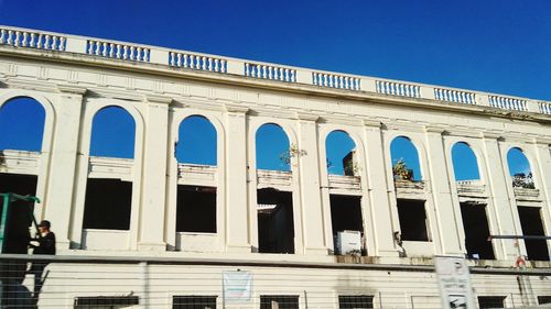 Low angle view of building against blue sky