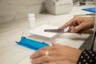 High angle view of person working on table