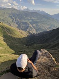 Man looking at mountains