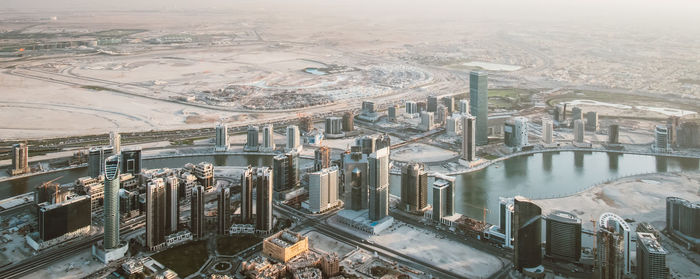 High angle view of city at riverbank