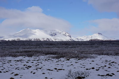 Scenic view of snowcapped mountains against sky