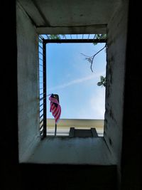 Low angle view of flag against building