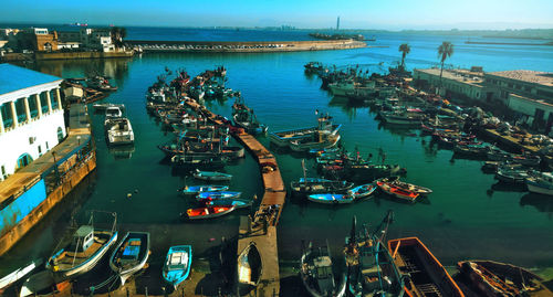 High angle view of boats moored at harbor