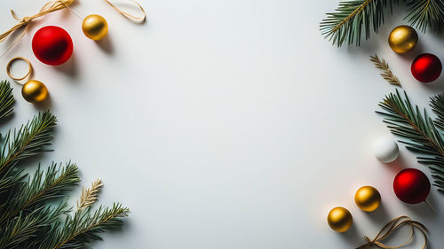 Close-up of christmas decorations on white background