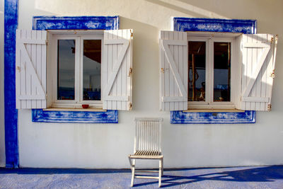 Empty chair outside building