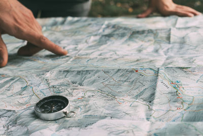 Planning the route on a map and a compass