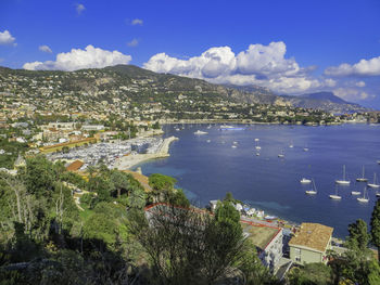 High angle view of townscape by sea