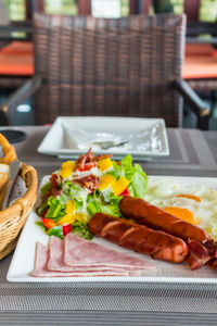 Close-up of breakfast served on table