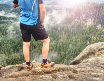 Rear view of man running on mountain