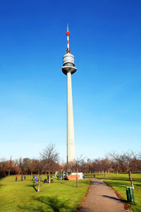 View of tower in park against blue sky