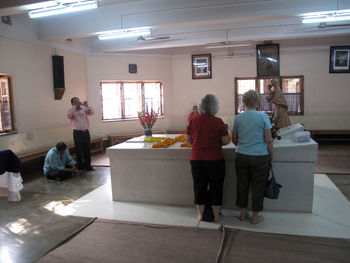 Rear view of people standing in corridor