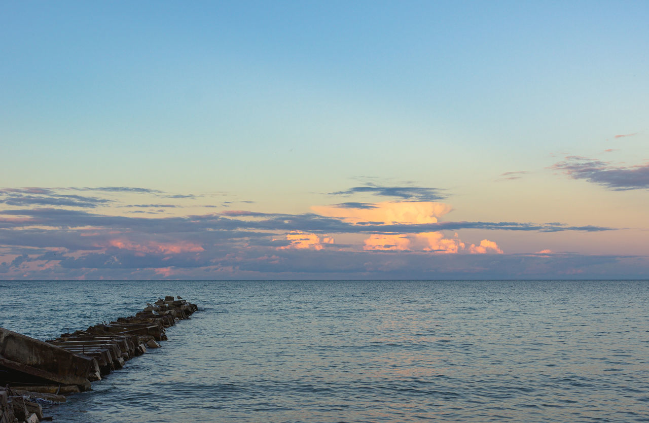 sky, water, sea, beauty in nature, scenics - nature, sunset, ocean, tranquility, horizon, shore, nature, cloud, body of water, horizon over water, coast, tranquil scene, land, beach, idyllic, blue, no people, seascape, dusk, bay, evening, outdoors, travel destinations, travel, wave, environment, reflection, landscape, sunlight, tourism, non-urban scene, vacation, trip, holiday