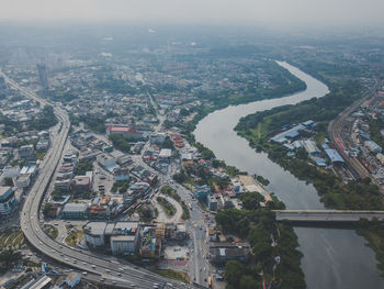 Aerial view of cityscape against sky