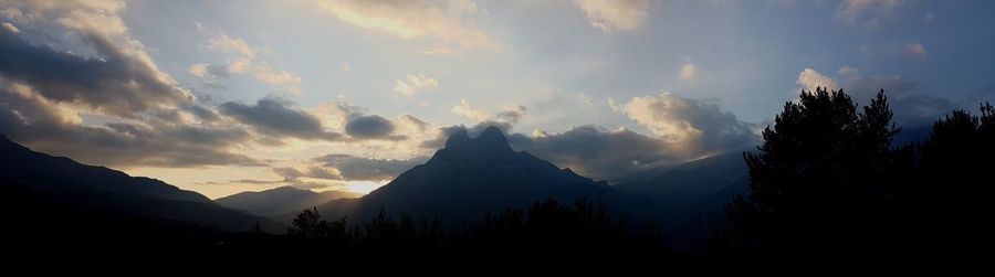 Silhouette mountains against sky during sunset