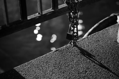 Close-up of chain hanging on rope