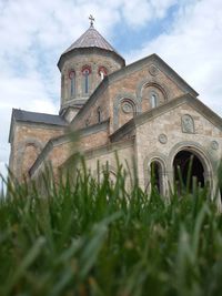 Low angle view of bell tower against sky