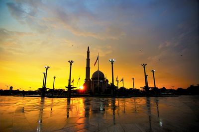 Scenic view of mosque against sky during sunset