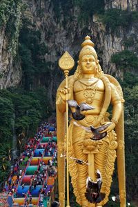 Statue of buddha against building