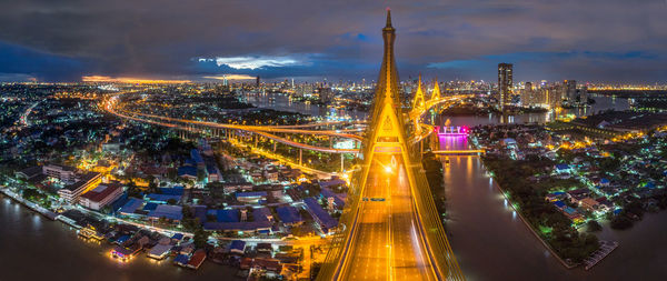 High angle view of city lit up at night