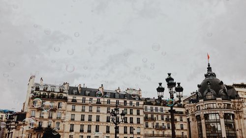 Buildings against sky during rainy season