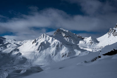 Scenic view of snow covered mountains