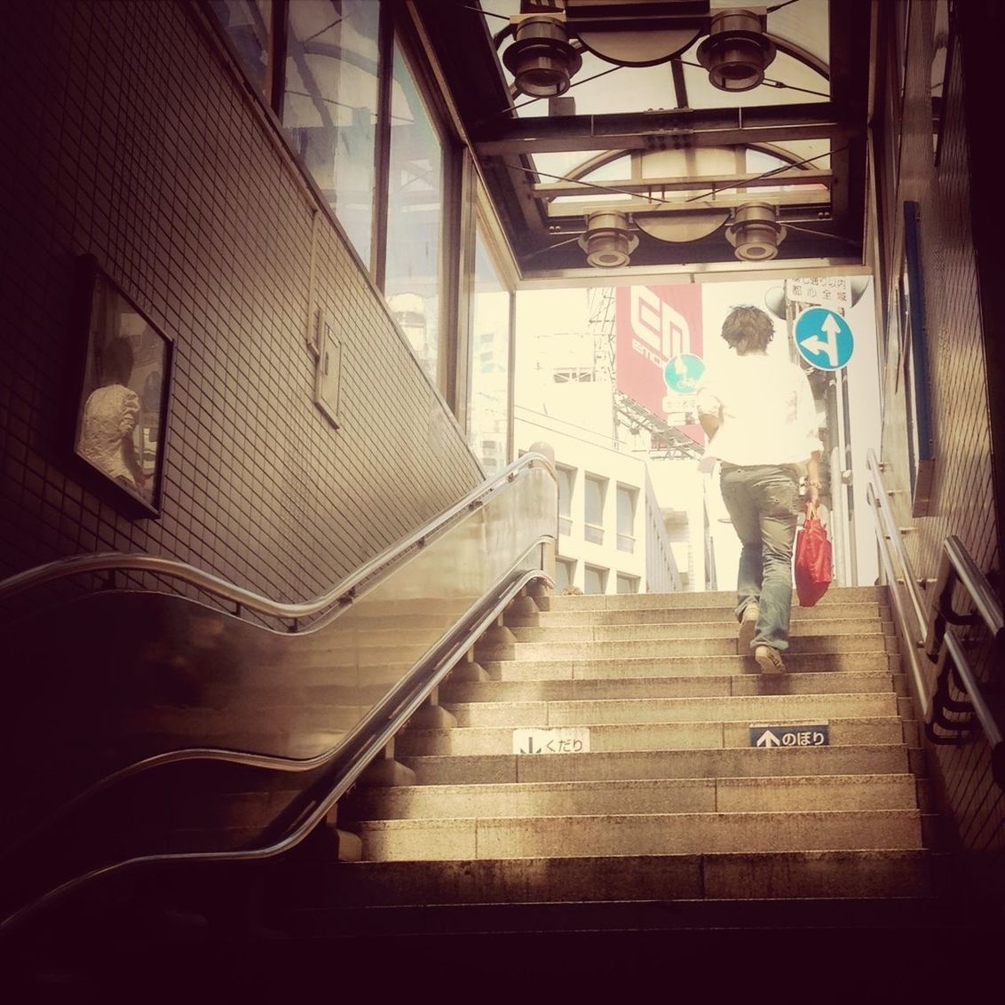 indoors, steps, technology, steps and staircases, railing, staircase, arts culture and entertainment, escalator, high angle view, architecture, built structure, music, musical instrument, day, incidental people, transportation, in a row, absence