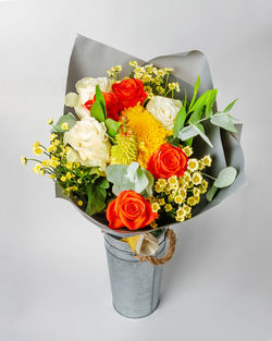 Close-up of rose bouquet against white background