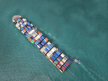 Aerial view of cargo ship in sea