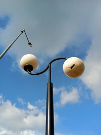 Low angle view of street light against sky