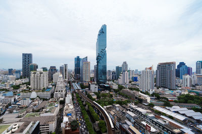 High angle view of modern buildings in city against sky
