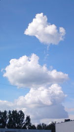 Scenic view of trees against cloudy sky