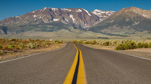 Road leading towards mountains