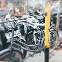 Close-up of bicycle parked on street in city