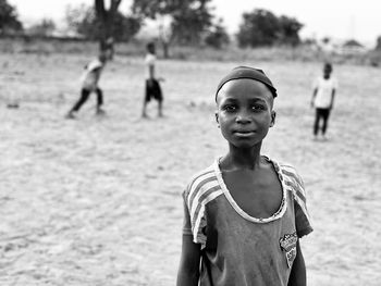 Portrait of boy wearing sunglasses on field