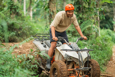 Side view of man working at farm