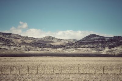 Scenic view of landscape and mountains against sky