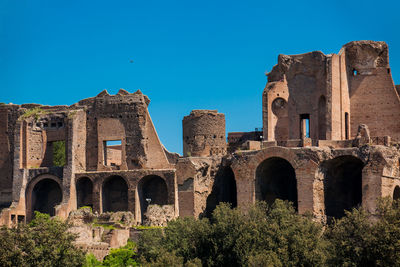 Low angle view of historical building against blue sky