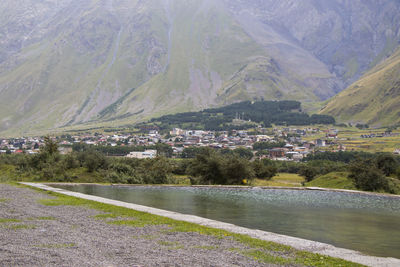 City view of stepantsminda, georgia. old houses and pool.mountain landscape.