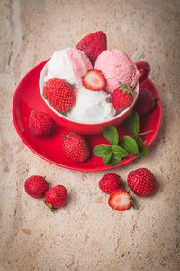 High angle view of strawberries in bowl on table