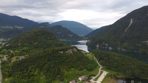 Scenic view of corlo lake and belluno mountains against sky. drone point of view.