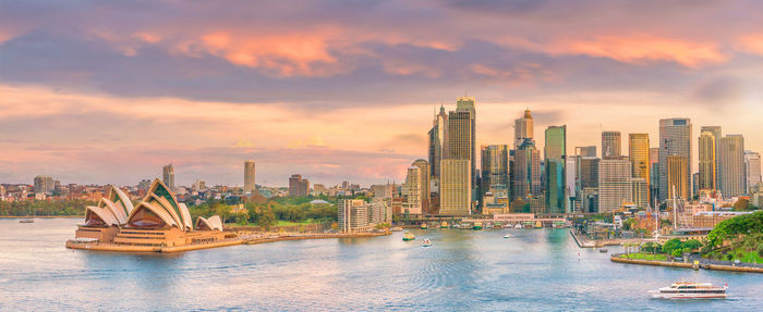 Panoramic view of buildings against sky during sunset