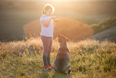 Full length of a dog standing on field