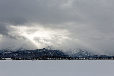 Scenic view of snowcapped mountains against sky