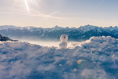 Snowcapped mountains against sky during winter