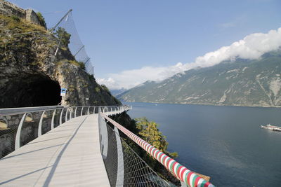 Bridge over mountains against sky