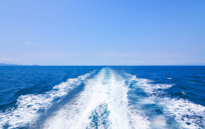 Scenic view of sea against blue sky